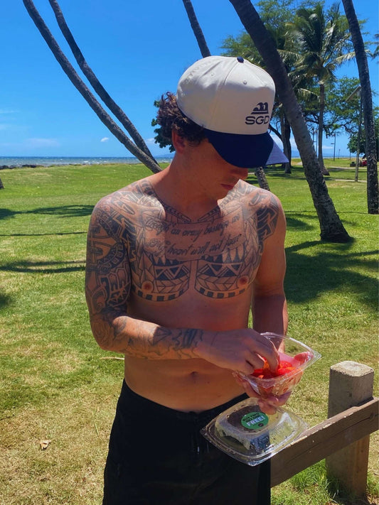 Classic SGD Snapback in navy and natural with strawberries on the beach — Seas Get Degrees coastal lifestyle