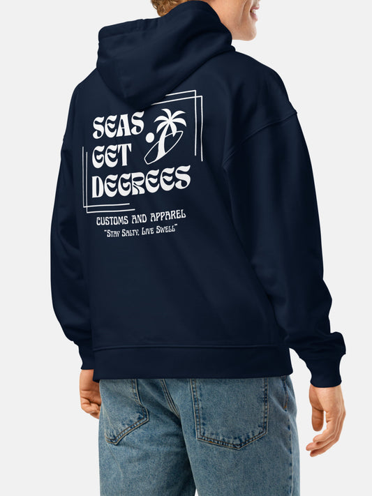 Model wearing Stay Salty Oversized Hoodie back in french navy — Seas Get Degrees men's coastal hoodie
