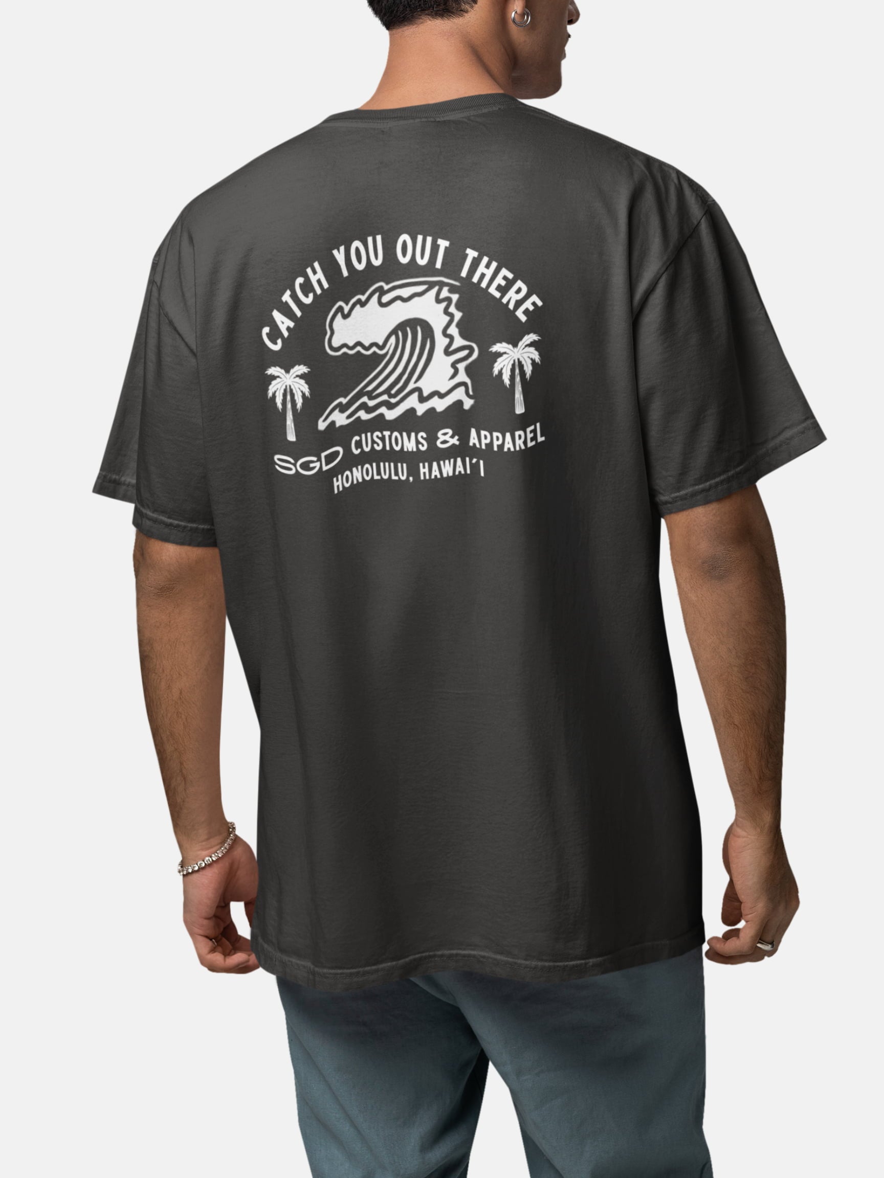 Model wearing Endless Wave Tee back in black rock — Seas Get Degrees men's coastal tee