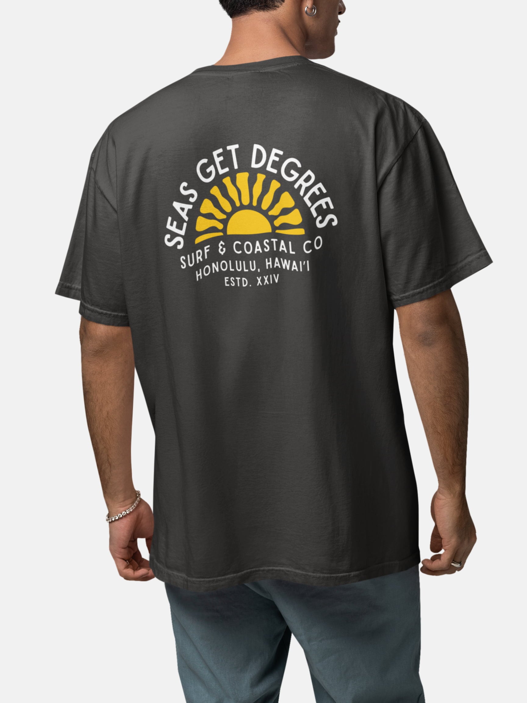 Model wearing Golden Tide Tee back in black rock — Seas Get Degrees men's coastal tee