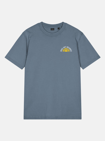 Golden Tide Tee front view in deep teal — Seas Get Degrees coastal graphic tee