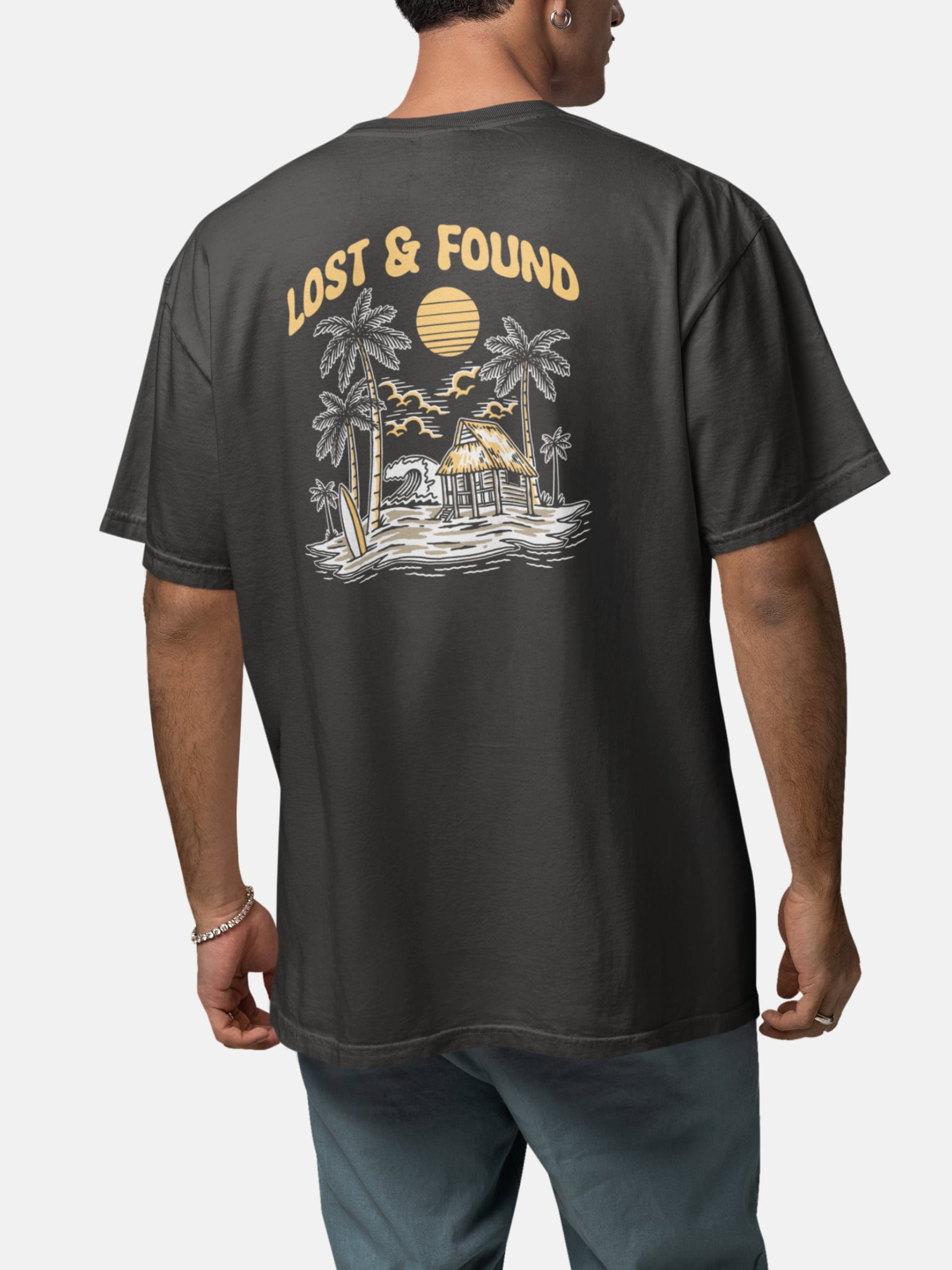 Model wearing Lost and Found Tee back in black rock — Seas Get Degrees men's coastal tee