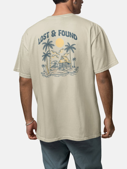 Model wearing Lost and Found Tee back in stone — Seas Get Degrees men's coastal tee