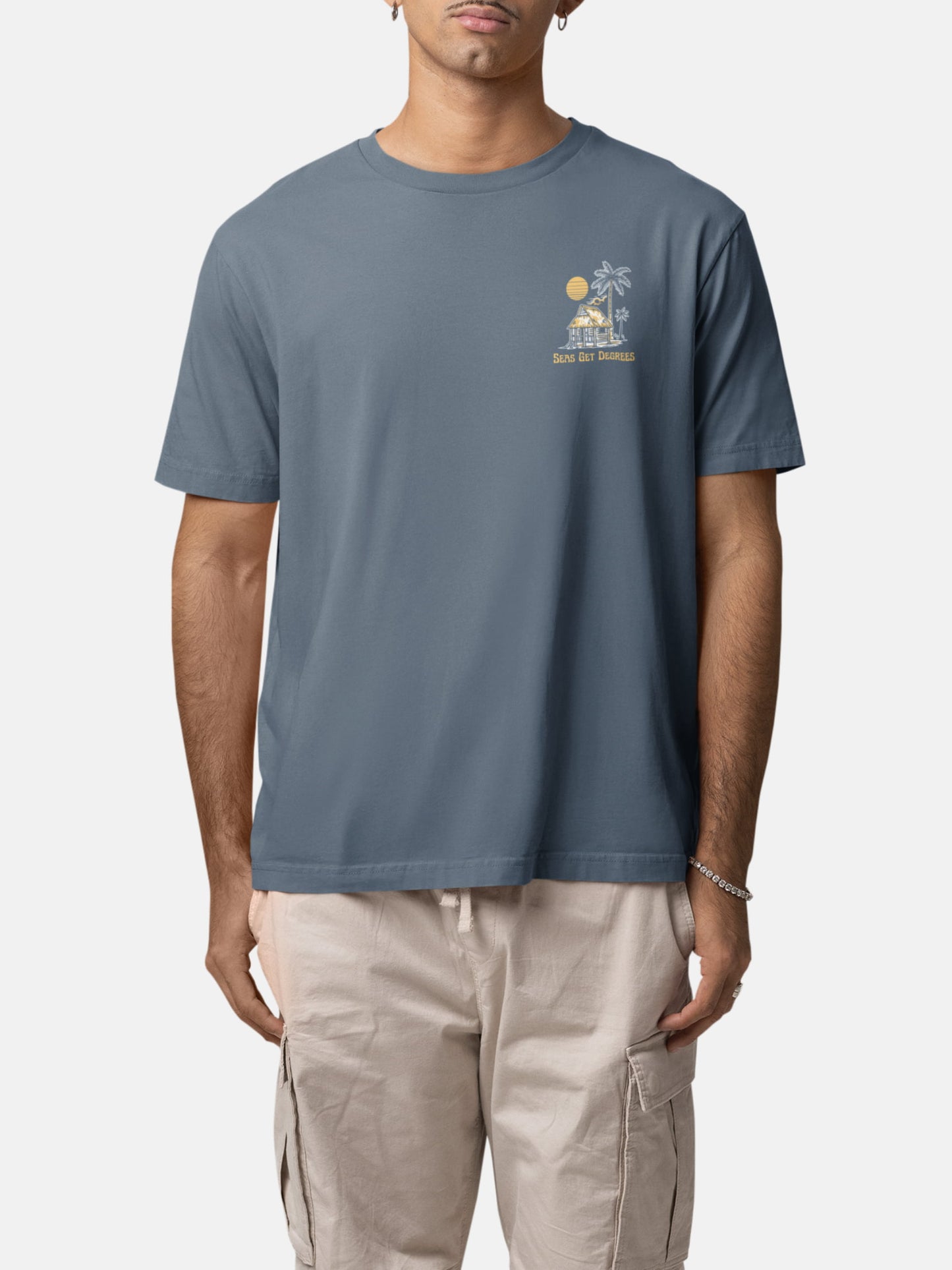 Model wearing Lost and Found Tee front in deep teal — Seas Get Degrees men's coastal tee