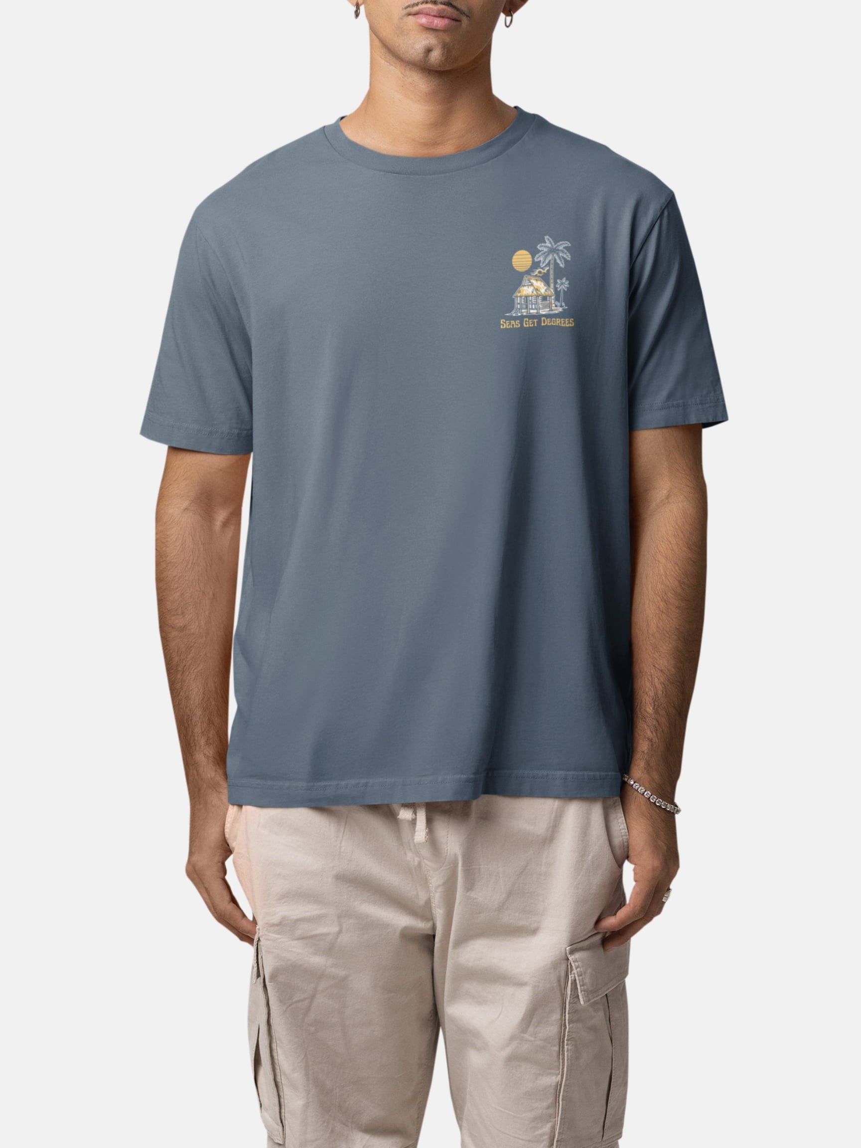 Model wearing Lost and Found Tee front in deep teal — Seas Get Degrees men's coastal tee