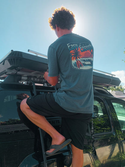 Model wearing Easy Enough Tee in deep teal at a camper van — Seas Get Degrees coastal lifestyle