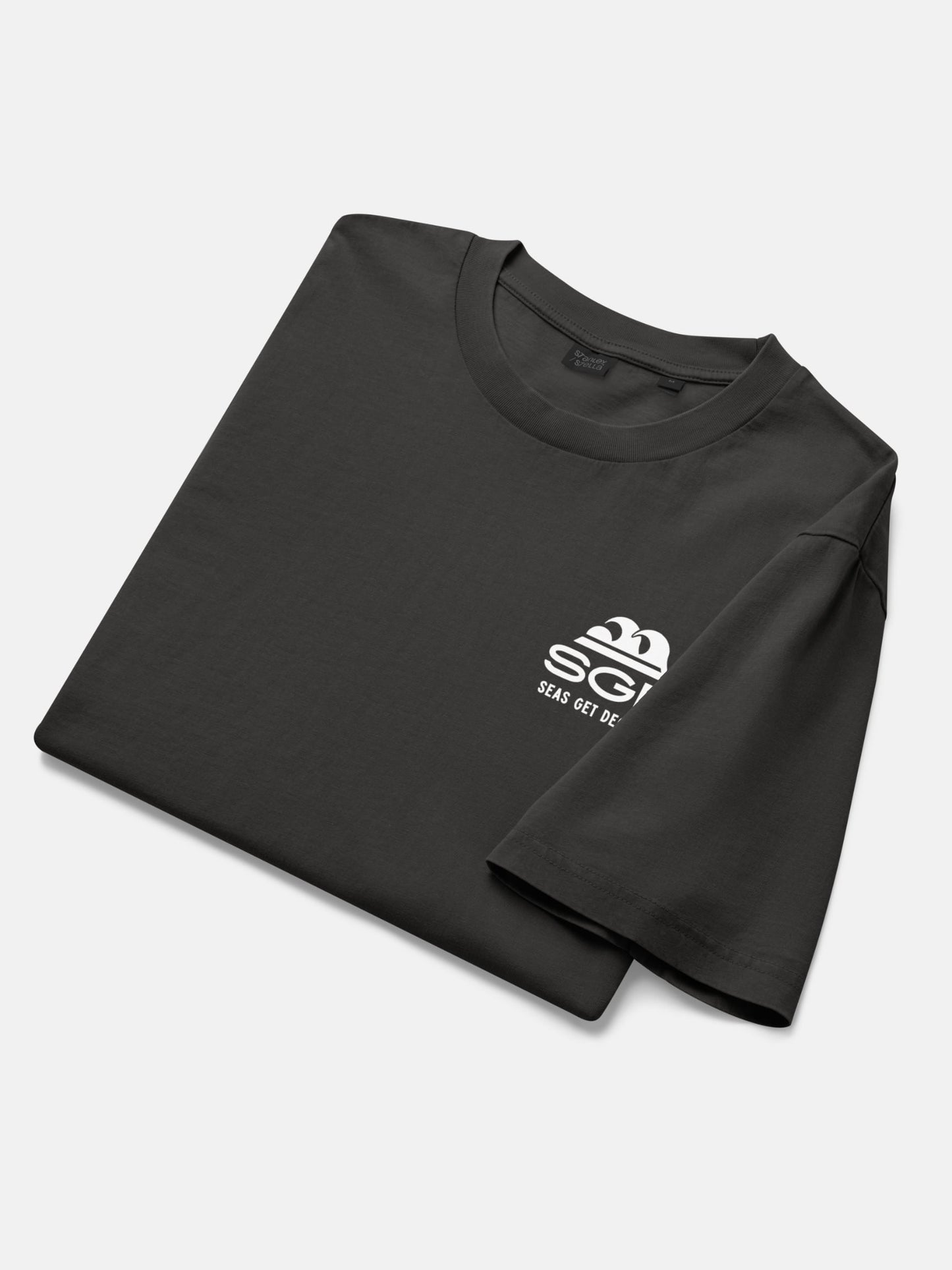 Seas Get Degrees Tee folded flat lay in black rock — Seas Get Degrees