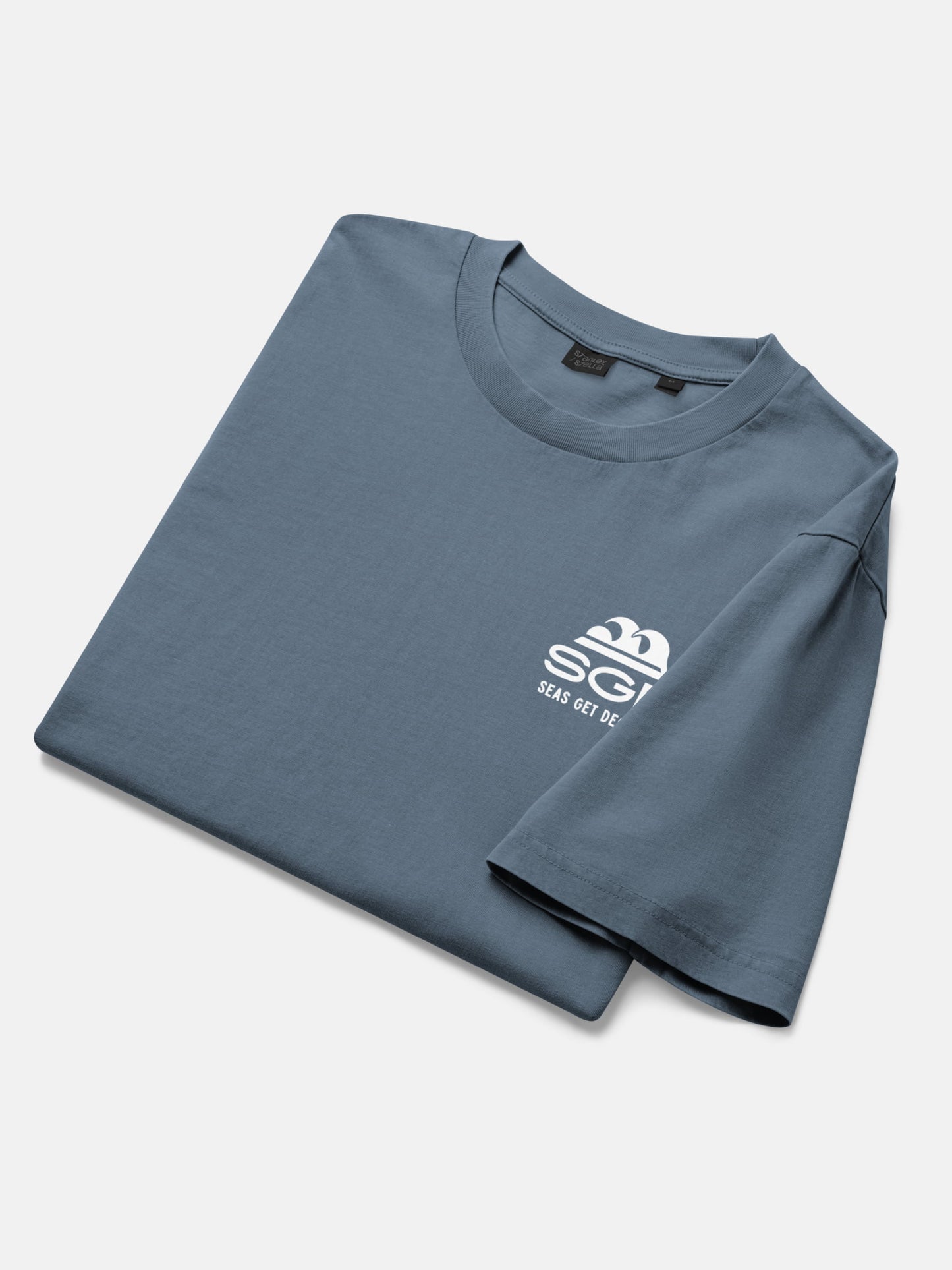 Seas Get Degrees Tee folded flat lay in deep teal — Seas Get Degrees