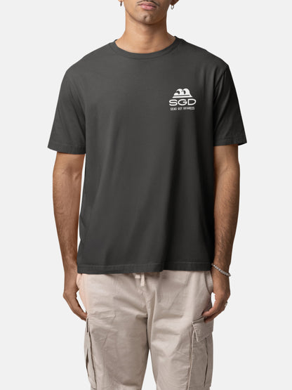 Model wearing Seas Get Degrees Tee front in black rock — Seas Get Degrees men's coastal tee