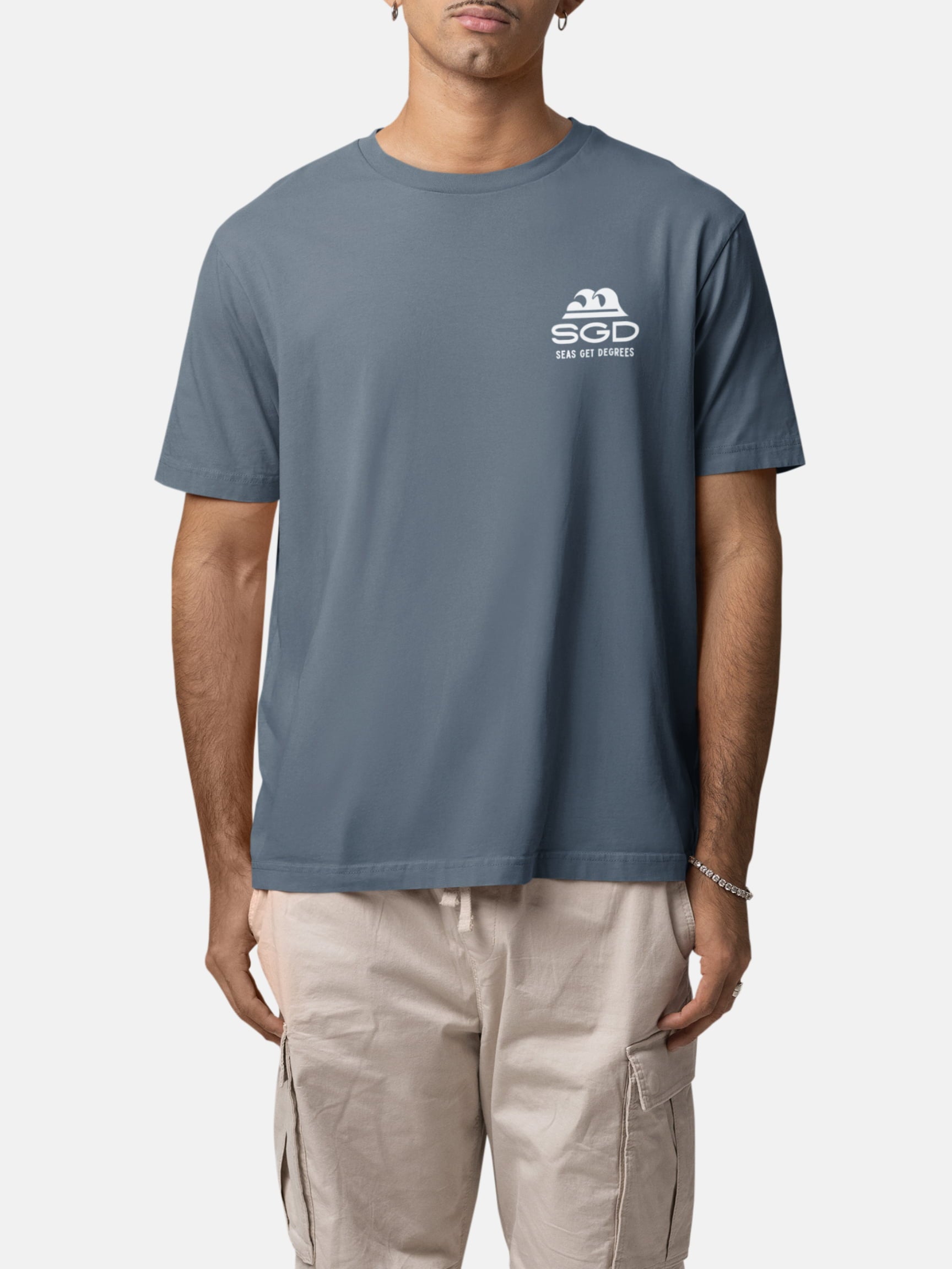 Model wearing Seas Get Degrees Tee front in deep teal — Seas Get Degrees men's coastal tee